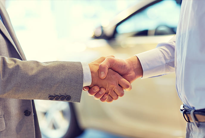 Image of two men shaking hands 